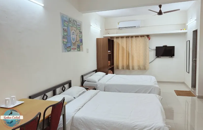 Two Queen Beds Room at Konkan Central Family Rooms, Kankavli: two queen beds, AC and TV